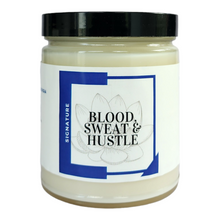 Load image into Gallery viewer, Blood, Sweat &amp; Hustle candle- This candle symbolizes what is means to is work hard for your goals and dreams by any means necessary. This blend of citrus, mango &amp; jasmine is dedicated to the hustlers, the go getters, the ones that makes shit happen! 